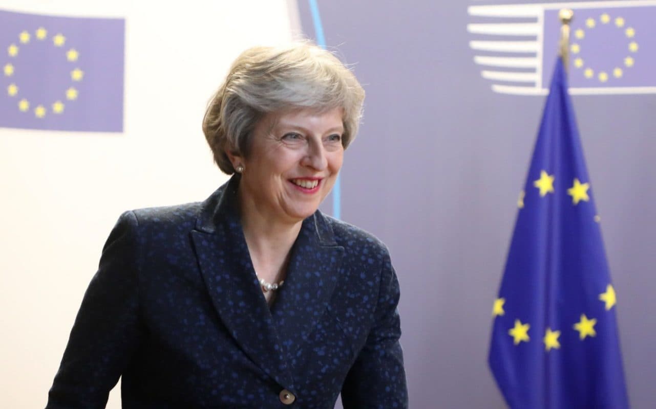 British Prime Minister Theresa May speaks to the press before leaving the first day of a European Union leaders' summit focused on migration, Brexit and eurozone reforms in Brussels on June 29, 2018