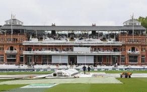 Groundstaff at work as the rain continues to fall during day one of the 2nd Specsavers Test Match between England and India at Lord's Cricket Ground 