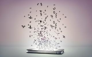 Streams of letters of the alphabet erupting from or pouring into a smartphone screen